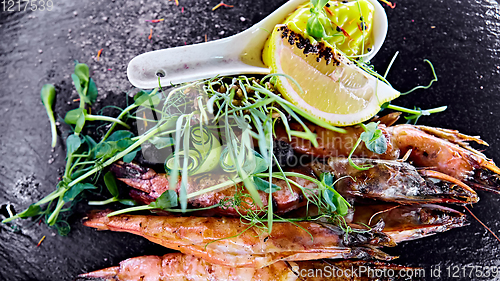 Image of Grilled shrimp skewers. Seafood, shelfish. Shrimps Prawns skewers with herbs, garlic and lemon.