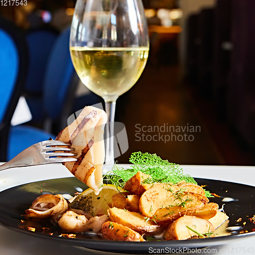 Image of The grilled squid with salad. Shallow dof.