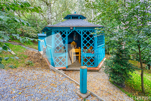 Image of Lovely turquoise gazebo in garden