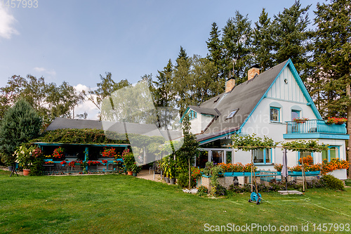 Image of rural house situated in garden