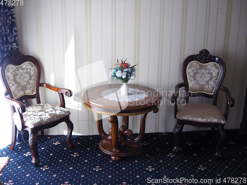 Image of cosy room in luxury style with chairs and table