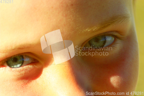 Image of teen's blue eyes staring up
