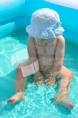 Image of baby takes a bath in the swimming pool