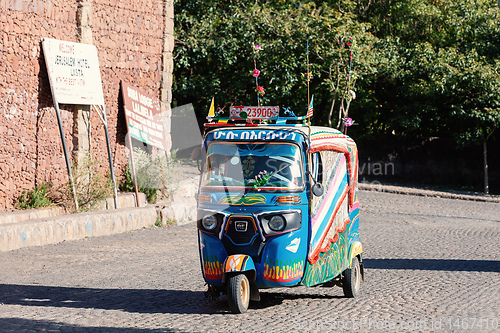 Image of blue color auto rickshaw known as Tuk tuk, Ethiopia