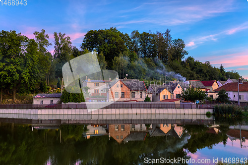 Image of village houses reflection in water