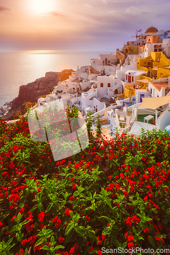 Image of Sunset over Oia town on Santorini island in summer. Santorini, Greece