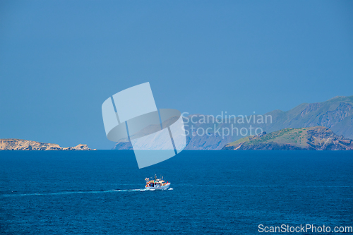 Image of Greek fishing boat in Aegean sea near Milos island, Greece