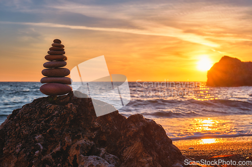 Image of Concept of balance and harmony - stone stack on the beach