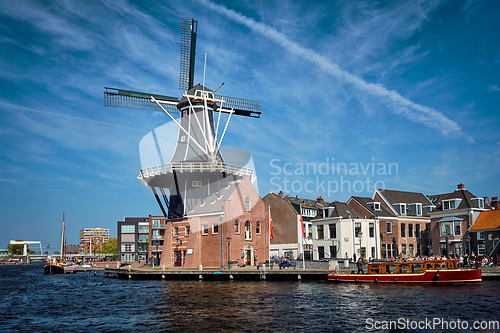 Image of Harlem landmark windmill De Adriaan on Spaarne river. Harlem,