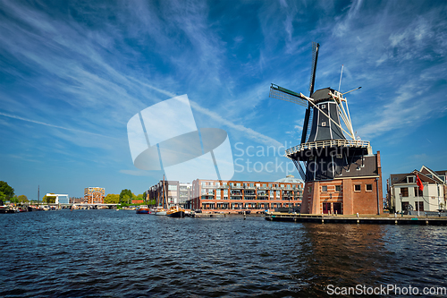 Image of Harlem landmark windmill De Adriaan on Spaarne river. Harlem,