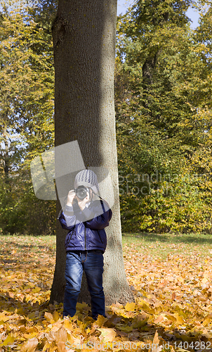 Image of a boy walking in the park