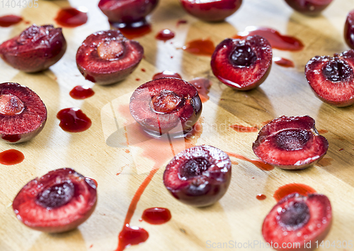 Image of sliced red sweet cherries