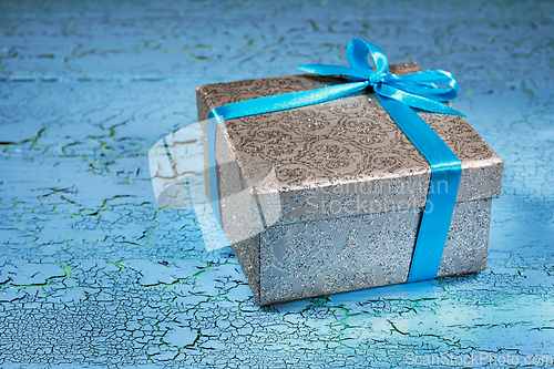 Image of Gift box with blue ribbon