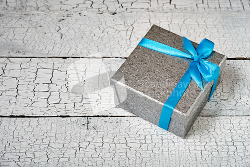 Image of Gift box with blue ribbon