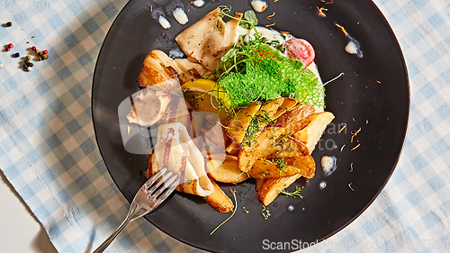 Image of The grilled squid with salad. Shallow dof.