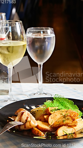 Image of The grilled squid with salad. Shallow dof.