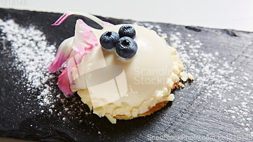 Image of The vanilla mousse with blueberry. Shallow dof.