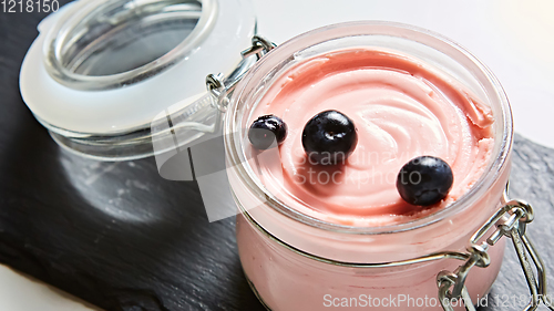 Image of Fresh strawberry yoghurt dessert in glass, selective focus