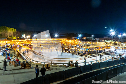 Image of beautiful outdoor ice rink at night with lights