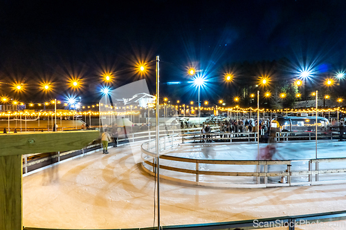 Image of beautiful outdoor ice rink at night with lights