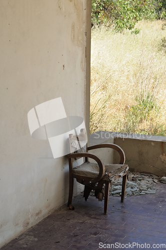 Image of old armchair abandoned porch