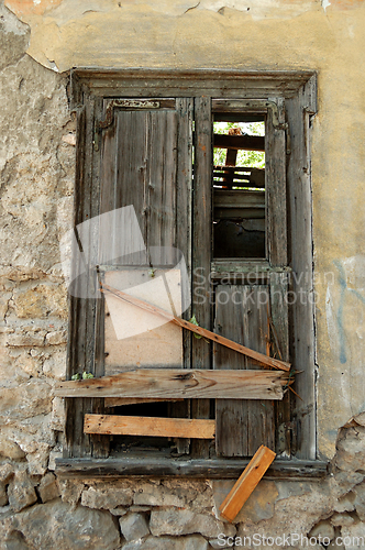 Image of boarded up old window shutter