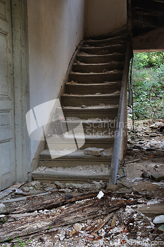 Image of old wooden staircase and dirty floor