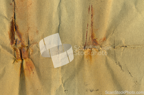 Image of paper with rust stains