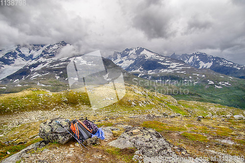 Image of Backpacker\'s bag on top of mountain