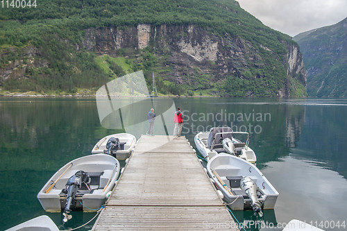 Image of Fisherman in Geiranger fjord of Norway