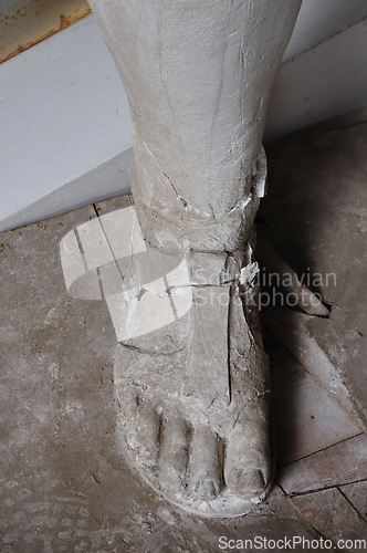 Image of broken statue foot detail