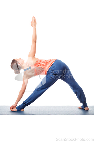 Image of Young fit woman doing Ashtanga Vinyasa Yoga asana