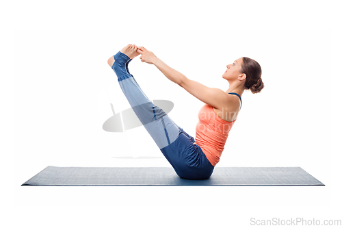 Image of Beautiful sporty fit woman practices yoga asana