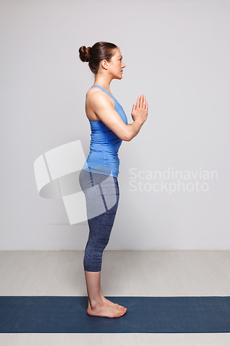 Image of Woman doing Hatha Yoga asana Tadasana