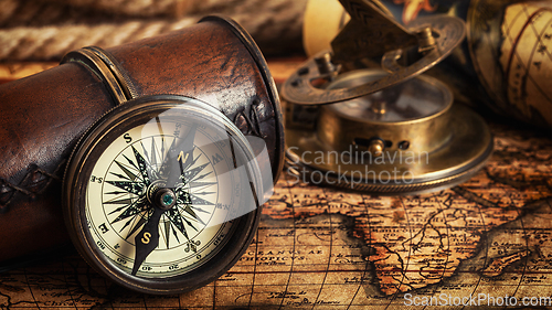 Image of Old vintage compass on ancient map