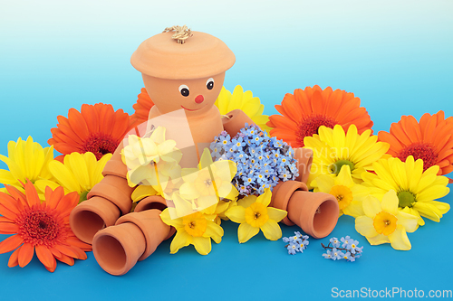 Image of Flowerpot Man Garden Ornament Bathed in Flowers 