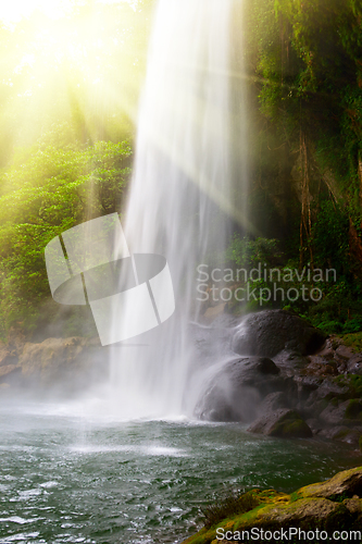 Image of Waterfall in jungles with sun