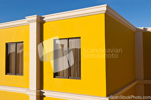 Image of Yellow house and blue sky