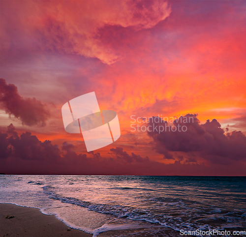 Image of Calm ocean and beach on tropical sunrise