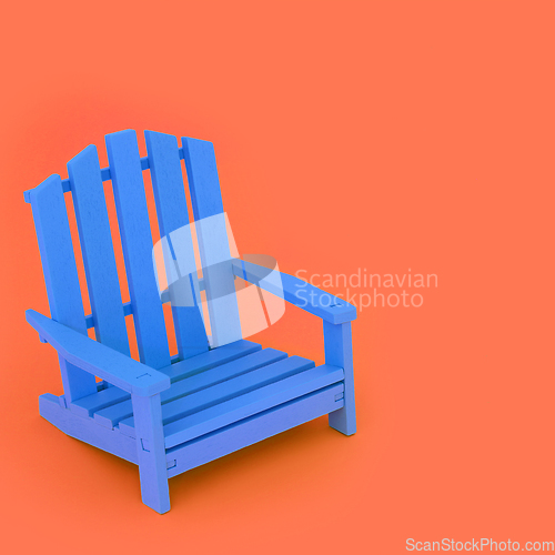 Image of Time for a Break with Blue Chair on Orange Background