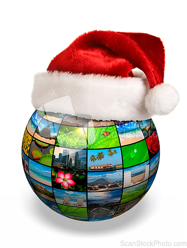 Image of Christmas concept - photo globe in Santa hat