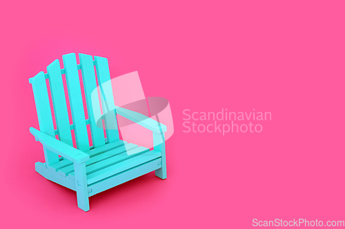 Image of Time to Relax Alone with Blue Chair on Vivid Pink Background