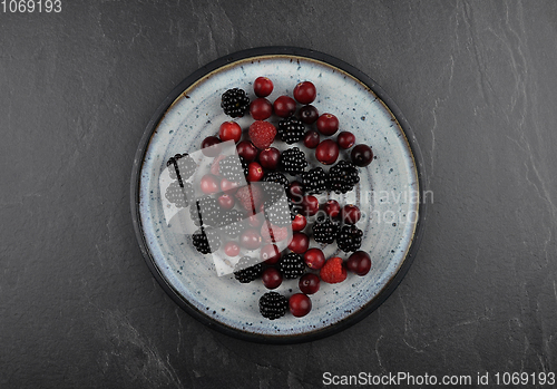 Image of Berries with plate on shale