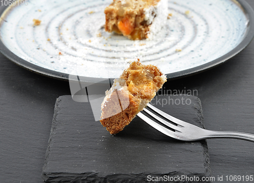 Image of Christmas stollen on fork and slate