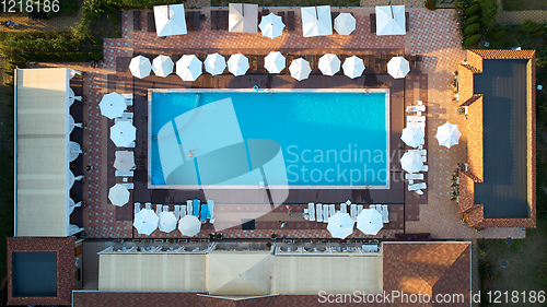 Image of Aerial view on people in swimming pool. Top view of people sunbathing pool.