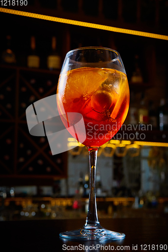 Image of Aperol Spritz Cocktail Alcoholic beverage based on bar counter with ice cubes and oranges