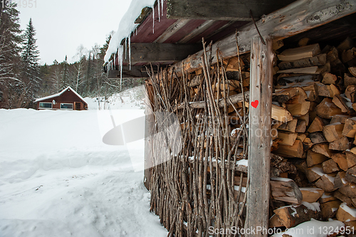 Image of Stack of natural wood, with red heart