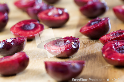 Image of sliced red sweet cherries