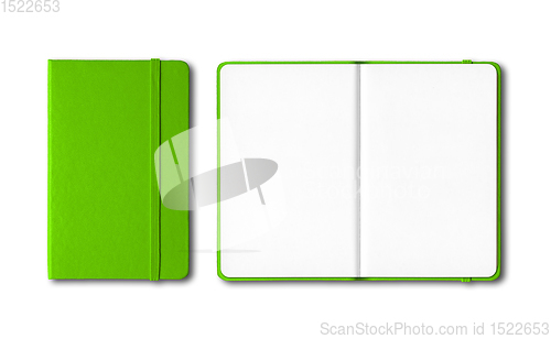 Image of Green closed and open notebooks isolated on white