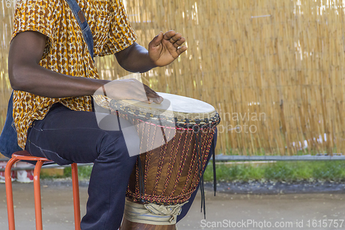 Image of african dlembe player